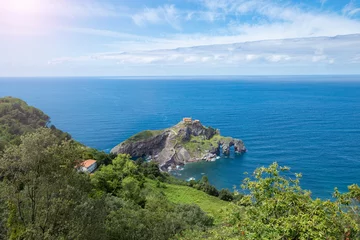 Fotobehang Island of gaztelugatxe on the Cantabrian coast with a stone staircase to go up to the hermitage of Saint John the Baptist, Famous place of San Juan de Gastelugache, Basque Country, Spain © Ирина Селина