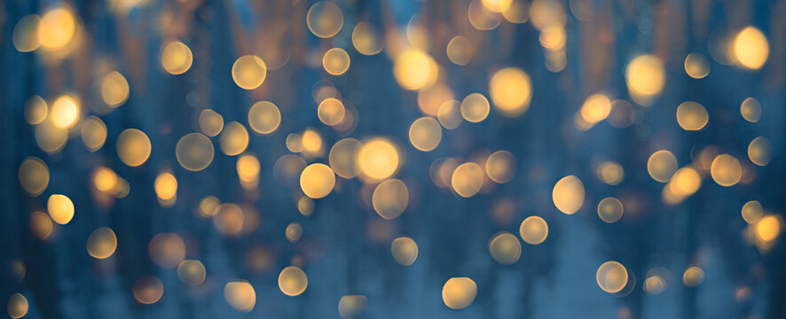 Blurred blue texture background with golden bokeh