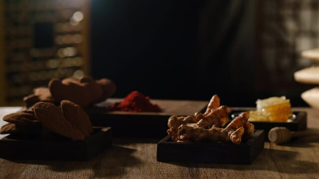 Front view of lighting with turmeric honey  lingzhi mushroom pack of medicine in a table , for chinese traditional medicine advertising