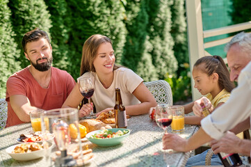 Cute family spending time in the back yard and looking happy