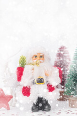 Santa, Christmas deer and festive decorations on table. Christmas still life web banner