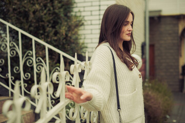 young woman portrait outdoor at fall season city street