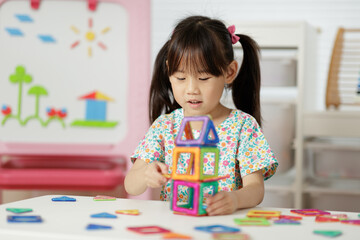 Young Girl Playing Creative 3D Shape Toy for Home schooling