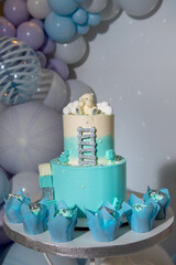 Festive white and blue birthday cake. Children's birthday. Candy bar with sweets.