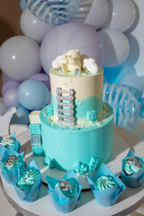 Festive white and blue birthday cake. Children's birthday. Candy bar with sweets.