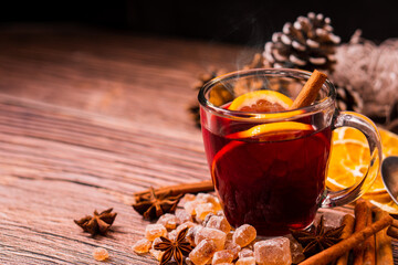 Gluhwein sweet hot warm Mulled red Wine or punch tea in mug cup glass spices citrus aromatic...