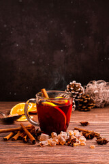 Gluhwein sweet hot warm Mulled red Wine or punch tea in mug cup glass spices citrus aromatic cinnamon star anise German tradition winter Christmas market beverage drink new year holidays festival