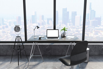 Creative designer desktop with empty white laptop, lamp, coffee cup and panoramic city view in the background. Mock up, 3D Rendering.