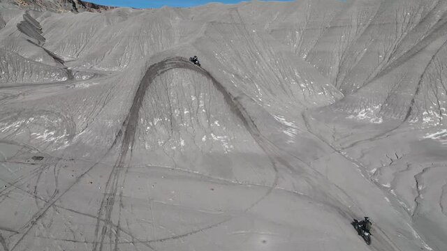 Dirt bikers riding the hills of Swing Arm City in Caineville Utah