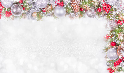 Obraz na płótnie Canvas Christmas Card. Fir Branches, Silver Balls and Snowfall on Holiday Background