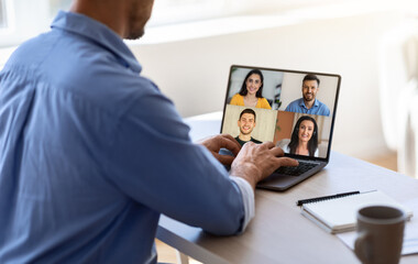 Fototapeta na wymiar Cropped millennial caucasian guy have online meeting with different employees on laptop screen at workplace