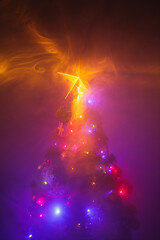 Christmas tree with shining star and dense smoke