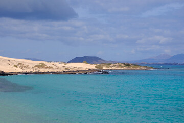 View on the Islands Lobos and Lanzarote from the Corralejo Beach on Fuerteventura.