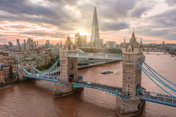 Aerial panoramic sunset view of London Tower Bridge and the River Thames, England, United Kingdom. Beautiful Tower bridge in London. © Aerial Film Studio