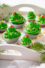 Unique green cupcakes with flower shaped green cream.
