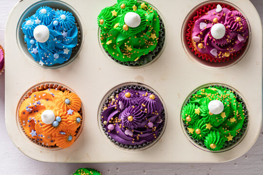 Cute multicolored cupcakes made of cream for fat thursday.