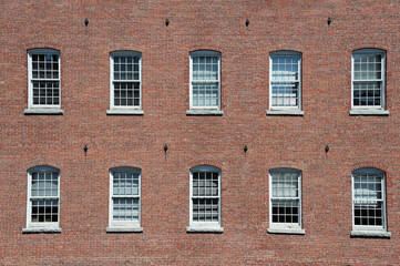 Fototapeta na wymiar facade view of brick wall and window of old factory building