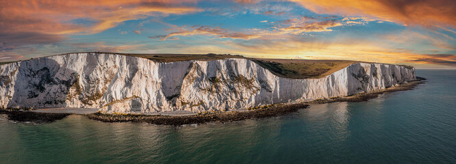 Aerial view of the White Cliffs of Dover. Close up view of the cliffs from the sea side. England, East Sussex. Between France and UK - Powered by Adobe
