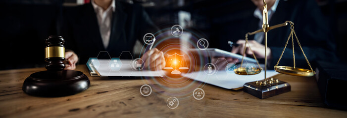 Concepts of Law and Legal services. Lawyer working with law digital interface icons. Blurred background.	