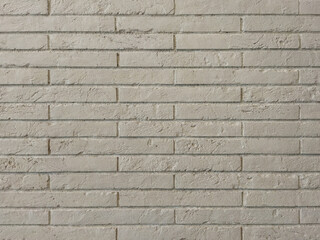 Gray, brick texture. A brick wall. Grey background with horizontal brickwork.