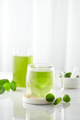 Centella juice and a white background for centella asiatica advertising , top view , photography drinks content