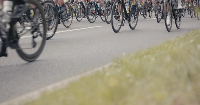 Cyclists bike riders bicycles on road marathon racing sport event day