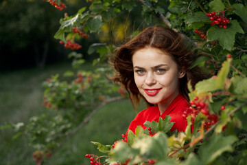 Obraz na płótnie Canvas smiling woman red lips posing nature fresh air summer