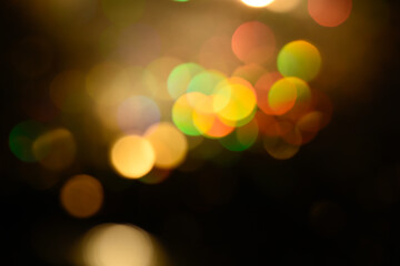 Obraz premium Multicolored glitter lights background. Blurry rainbow defocused circles. Abstract illuminated backdrop or overlay.