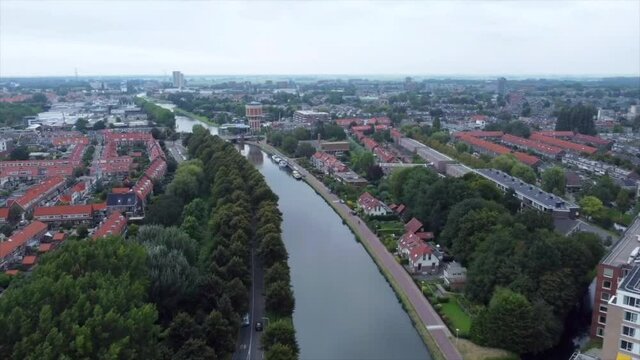 Aerial shot of road and river flowing through city in the Netherlands