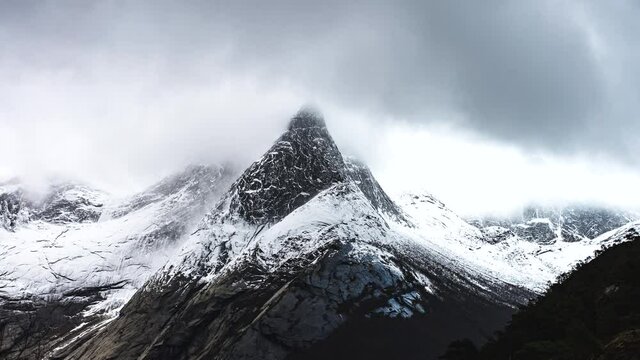 Distinctive snow-covered Stetind mountain, Norway; dramatic time lapse