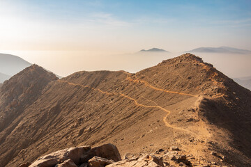 mountainous landscape, view from the top of a mountain, blue sky.
