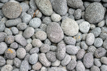 Fototapeta na wymiar decorative grey pebbles as a background