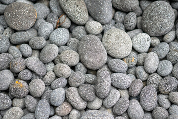 Fototapeta na wymiar decorative grey pebbles as a background