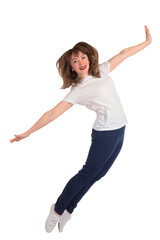 Happy woman on a white background. Portrait of a jumping contented girl. Brown-haired woman in white tee-shirt is smiling. Lifestyle portrait of young woman. Vertical photo of satisfied student girl.