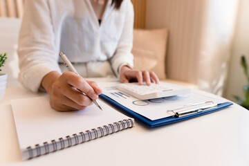 Business woman taking notes at office workplace ,Business job offer, financial success, certified public accountant concept.