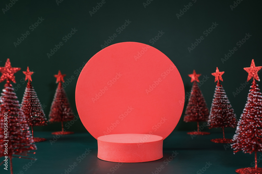 Poster christmas tree red color with star pine tree group on green background with space