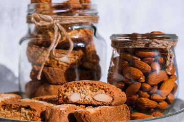 Traditional Italian cantuccini cookies with almonds in glass jar. Sweet dried biscuits. Homemade...