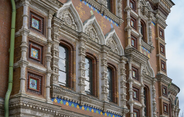 Details of the facade of the ancient Church of the Savior on Spilled Blood in St. Petersburg (Russia). Lots of colorful decorations in the masonry walls and windows. Monument of Russian architecture 