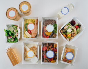 Fototapeta na wymiar food in containers. proper nutrition, daily diet, weight loss. soup, drink, salad, steak. Top view