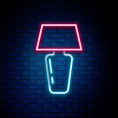 Glowing neon line Table lamp icon isolated on brick wall background. Desk lamp. Colorful outline concept. Vector