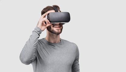 Young man using virtual reality headset isolated studio portrait, VR, future, gadgets, technology...