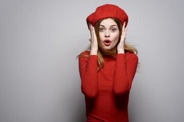 pretty woman in a red sweater cosmetics emotion isolated background