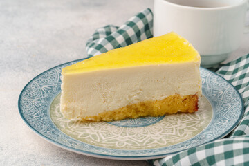 Lemon cheesecake on the plate close up
