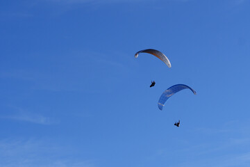 Paraglider flying over mountains in summer day in front of the mountain, High quality photo