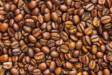 Coffee roasted beans texture background. Beverage, food, morning refreshment