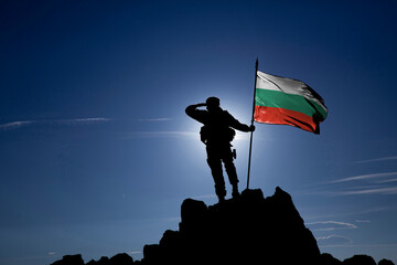 Silhouette of an unrecognizable soldier with the Bulgarian flag