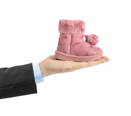 Hand with child shoe