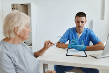 Fototapeta premium elderly woman patient at the doctor's appointment hospital visit