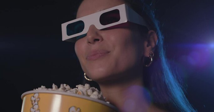Woman watching a movie with 3D glasses