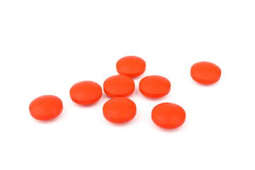 Red pills on a white background, isolated. Pharmacy. Treatment.